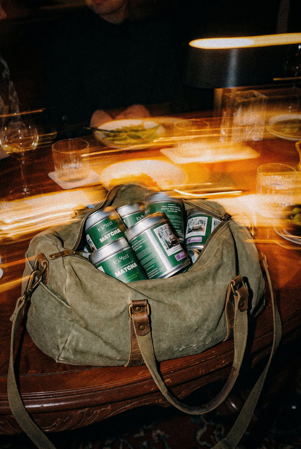A bag packed with KaMoss matcha tins